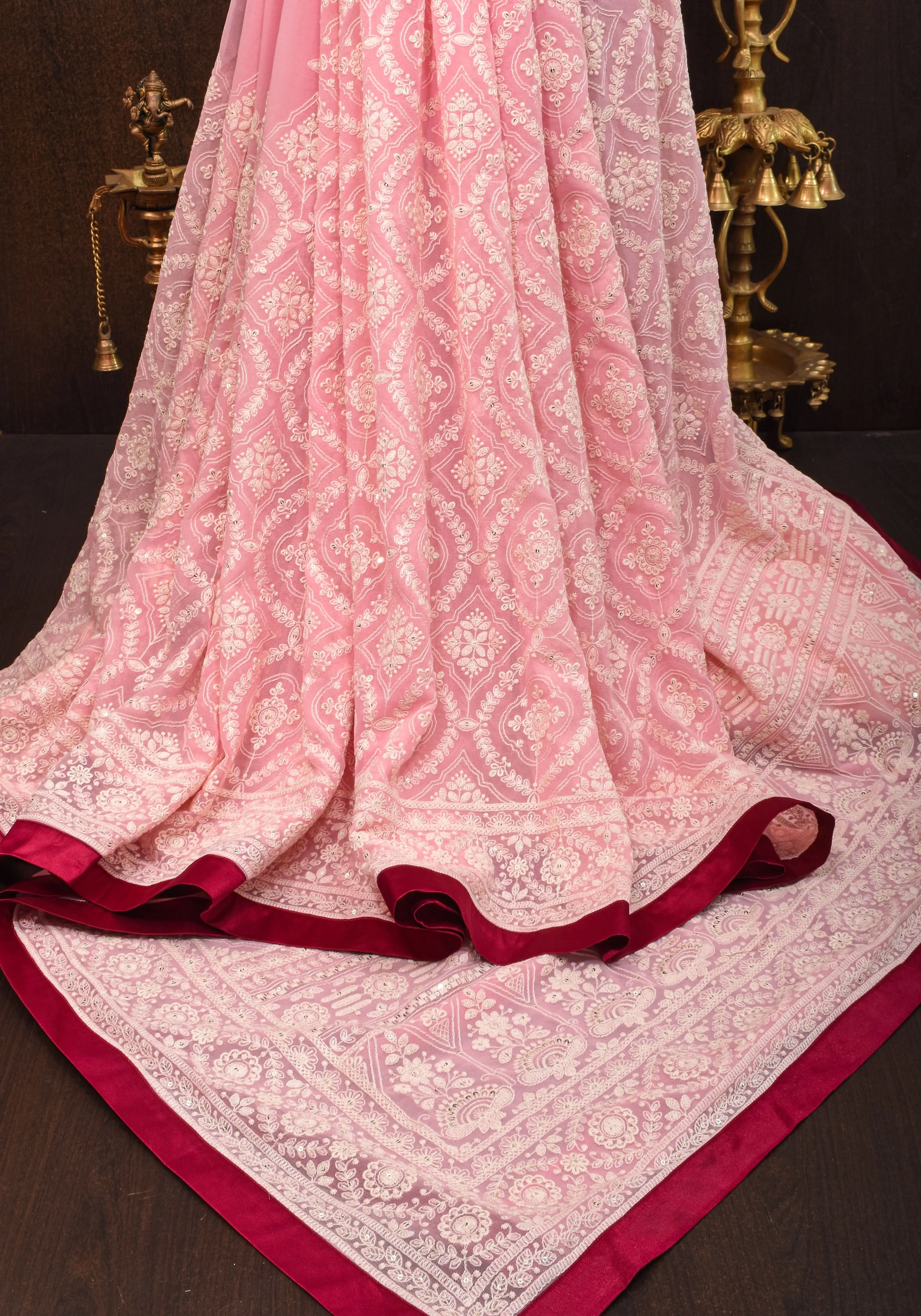 Charming Pink Georgette Saree with Self Embroidery and contrasting Pomegranate satin trim